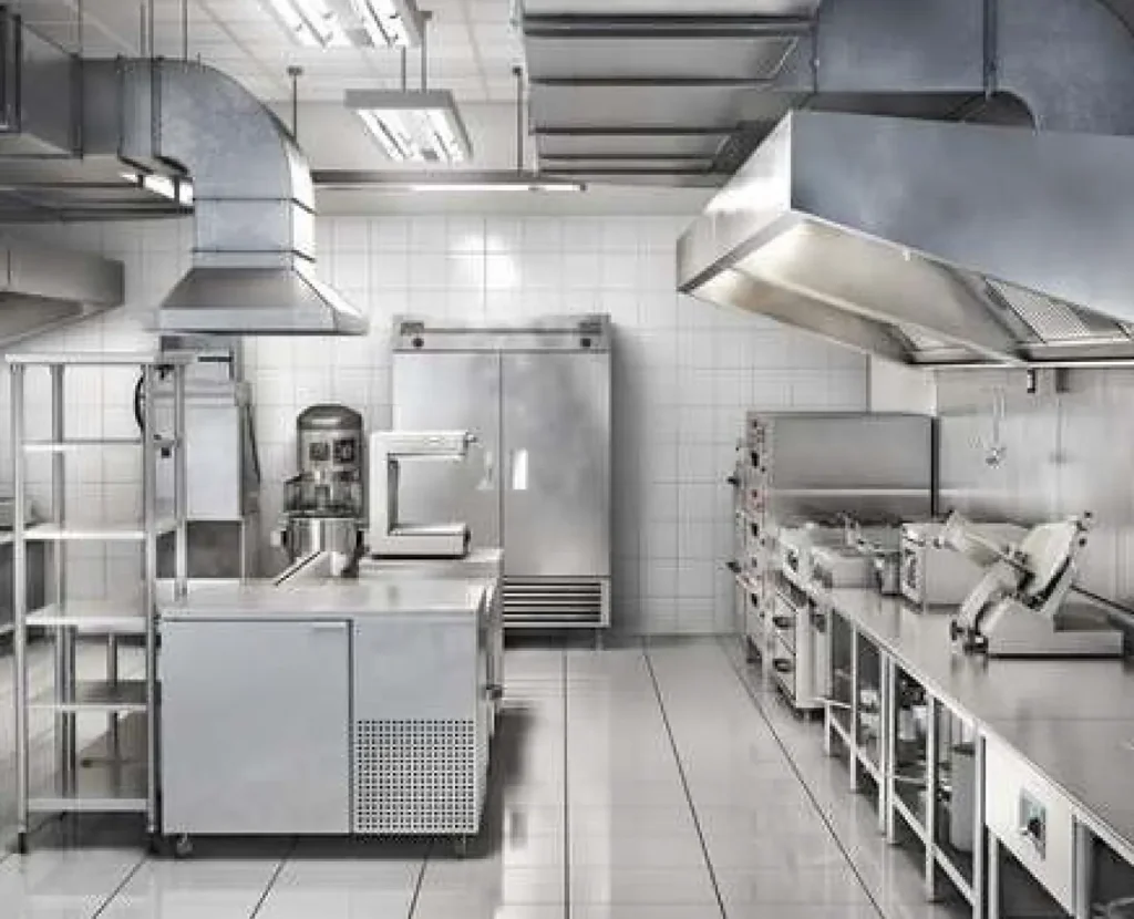 Stainless steel commercial kitchen with extraction hood at Bajee Restaurant