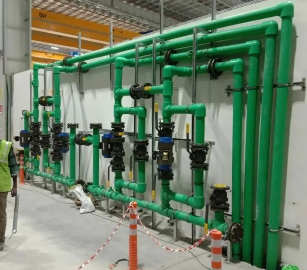Green PPR piping network with valves and pump connections