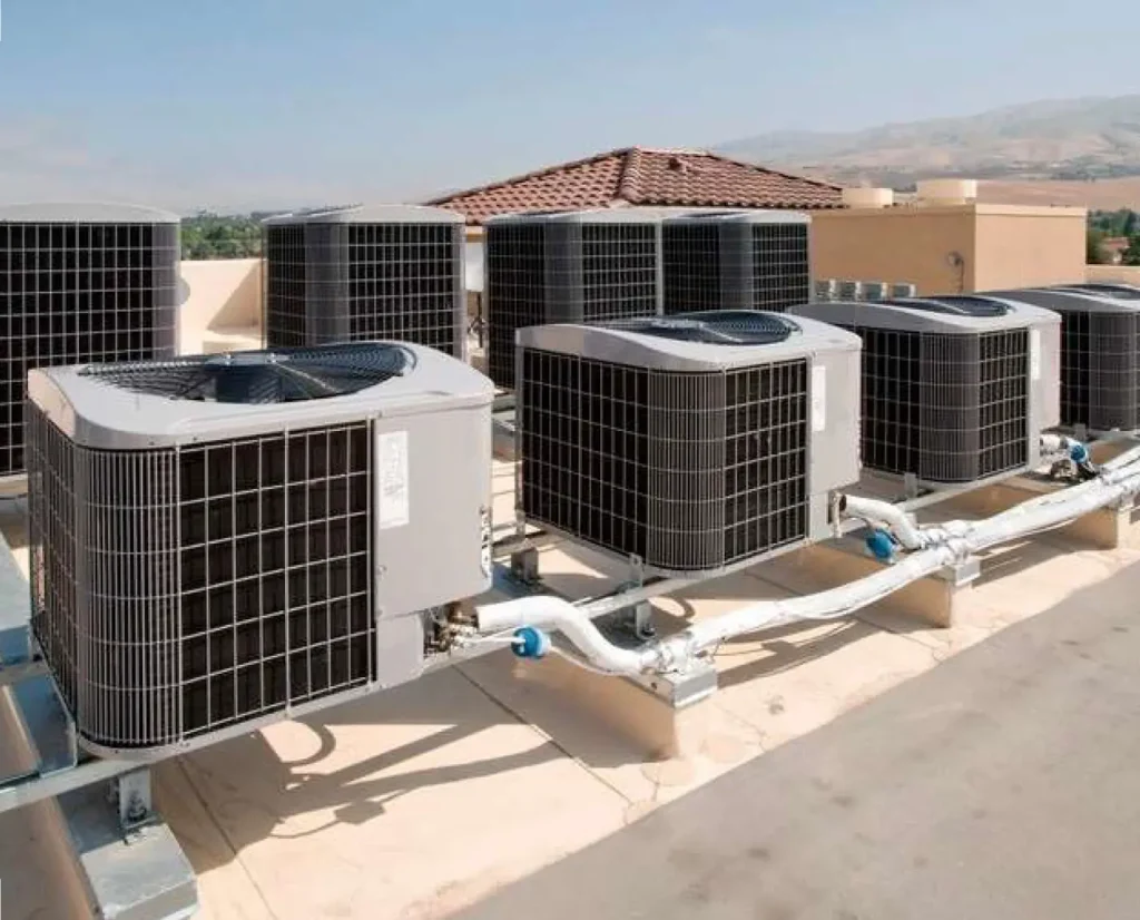 Outdoor air-conditioning units and piping at the training camp accommodation, Al Watba